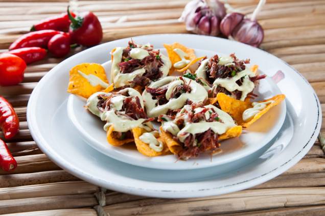 O bar Pé Pra Fora serve os canapés de carne seca com Doritos por (R$ 14,90) O bar Pé Pra Fora serve os canapés de carne seca com Doritos por (R$ 14,90)