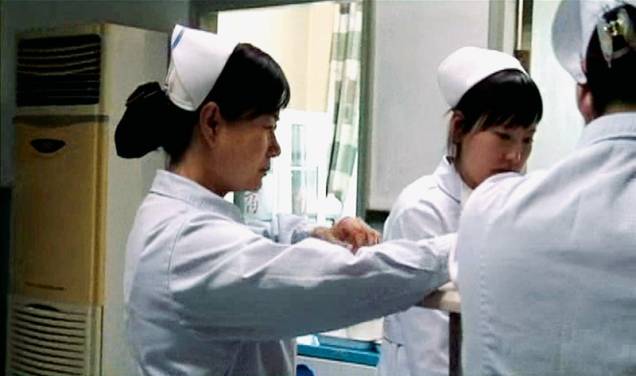 Cena do documentário A Realidade da Aids: painel dos doentes na China Cena do documentário A Realidade da Aids: painel dos doentes na China