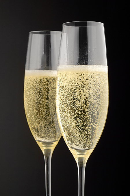 Two champagne glasses with champagne