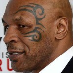 O prêmio de tatuagem mais incrivelmente errada vai para: óbvio, Mike Tyson