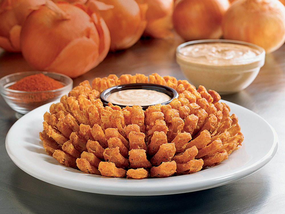 Bloomin’Onion, cebola gigante frita, do Outback Steakhouse. Bloomin’Onion, cebola gigante frita, do Outback Steakhouse.