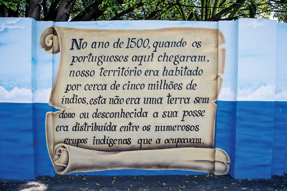 grafite de um texto que conta a história de origem do bairro