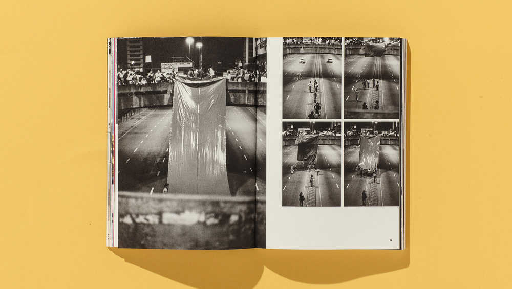 Imagem mostra intervenções artísticas em um túnel da Avenida Paulista com panos grandes e extensos