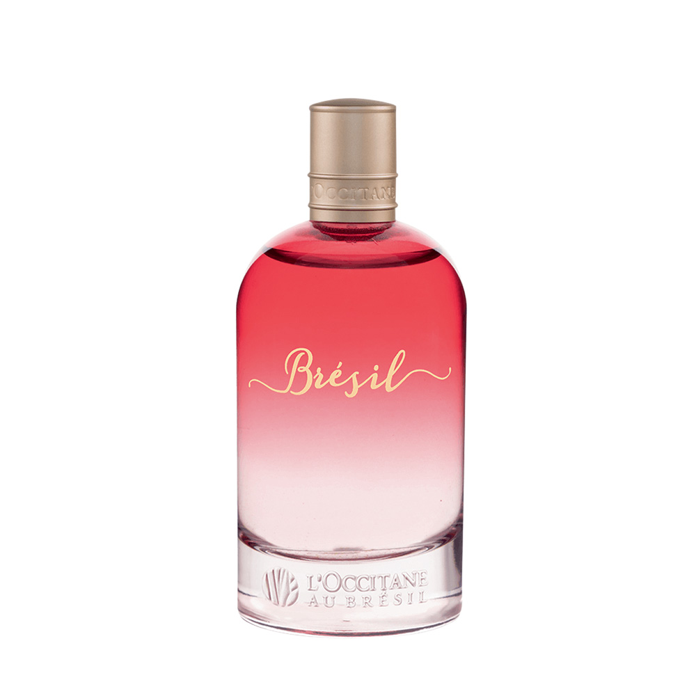 Frasco de perfume de vidro em degradê rosa até um rosa bem claro com o escrito 