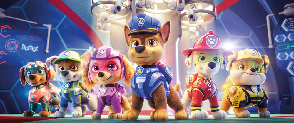 A imagem mostra seis cachorrinhos da animação Patrulha Canina. Eles estão vestidos com uniformes coloridos e sorriem.