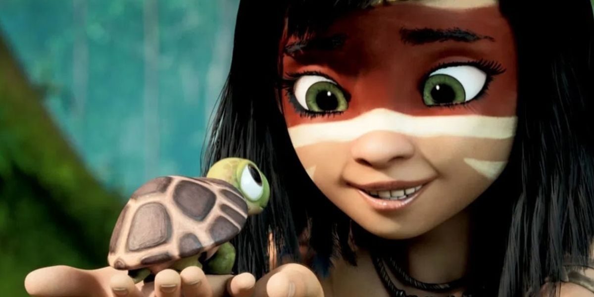 A imagem mostra uma menina admirando uma pequena tartaruga