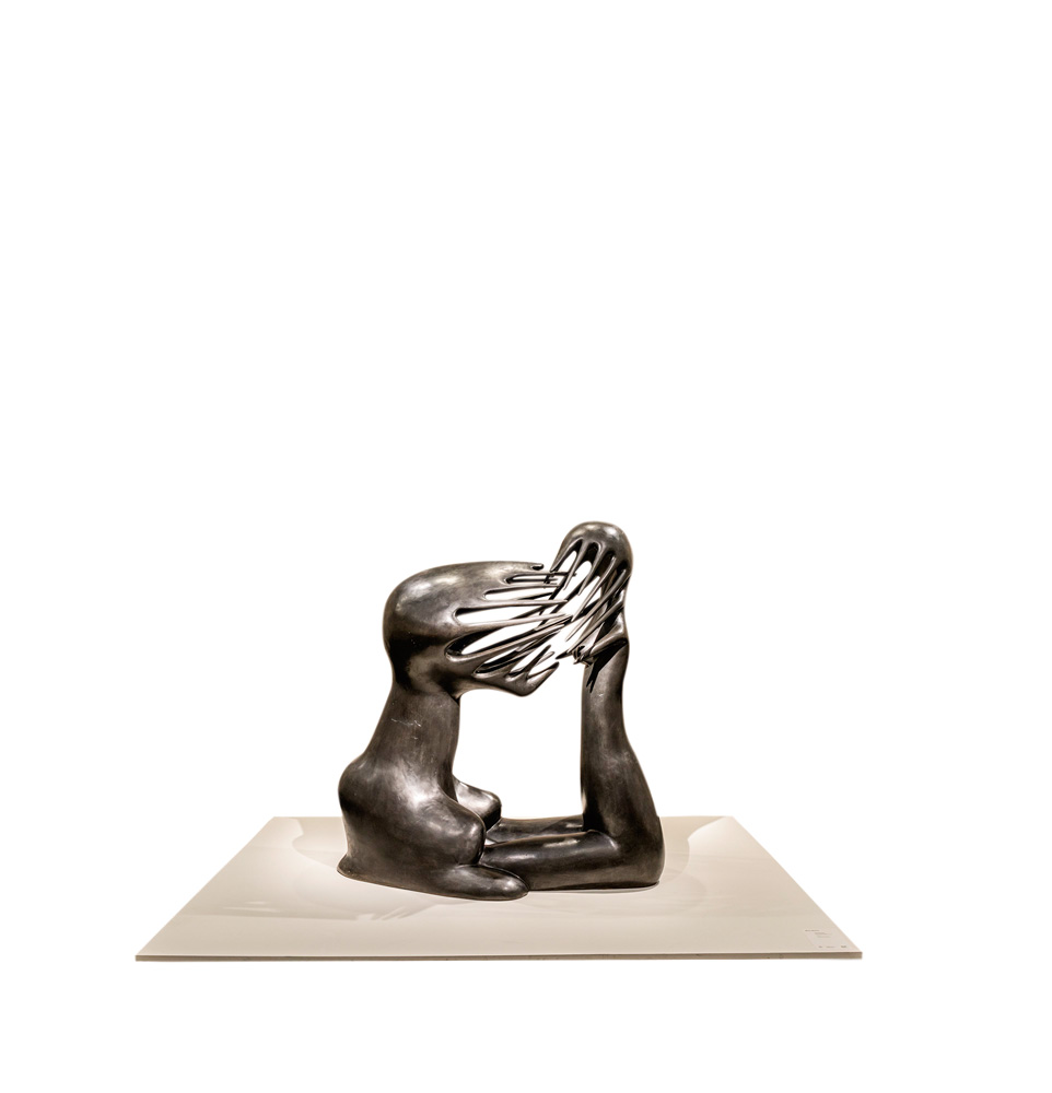 escultura o impossível em bronze