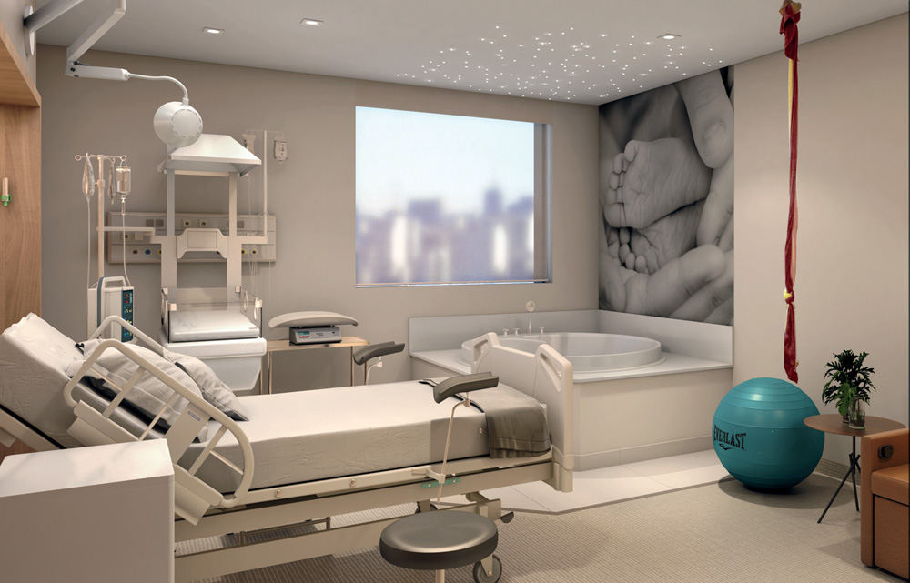 Sala de hospital com maca, poltrona, bola de pilates e outros artigos, em um ambiente amplo, arejado e luxuoso