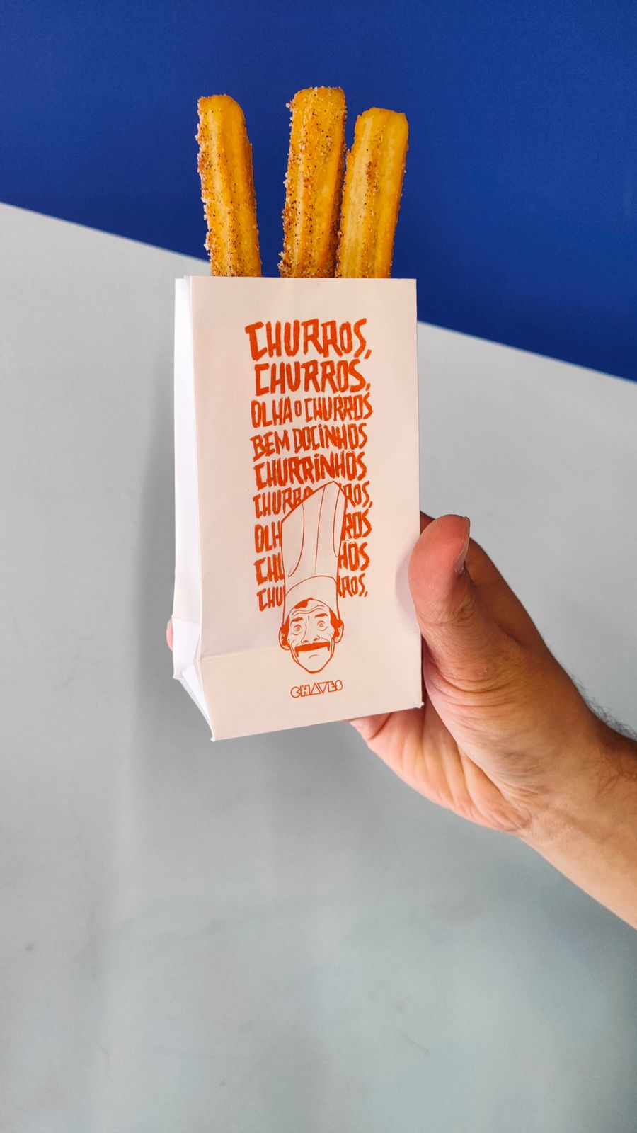 churros da dona florinda – Patties imagem de um pacote branco com 3 churros dentro