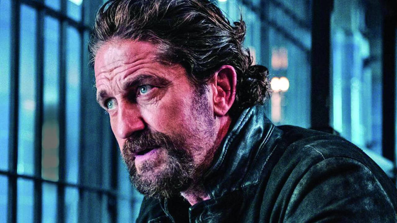 Imagem mostra homem de barba e cabelo castanho e olhos azuis, olhando para o lado.
