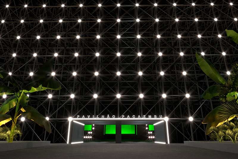 Entrada do Pavilhão Pacaembu, com pontos de luzes brancas e uma trave de gol na porta de entrada