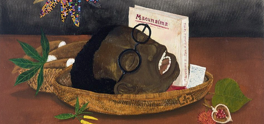 Imagem mostra desenho de cabeça de homem negro em bacia, ao lado de livro com o título 