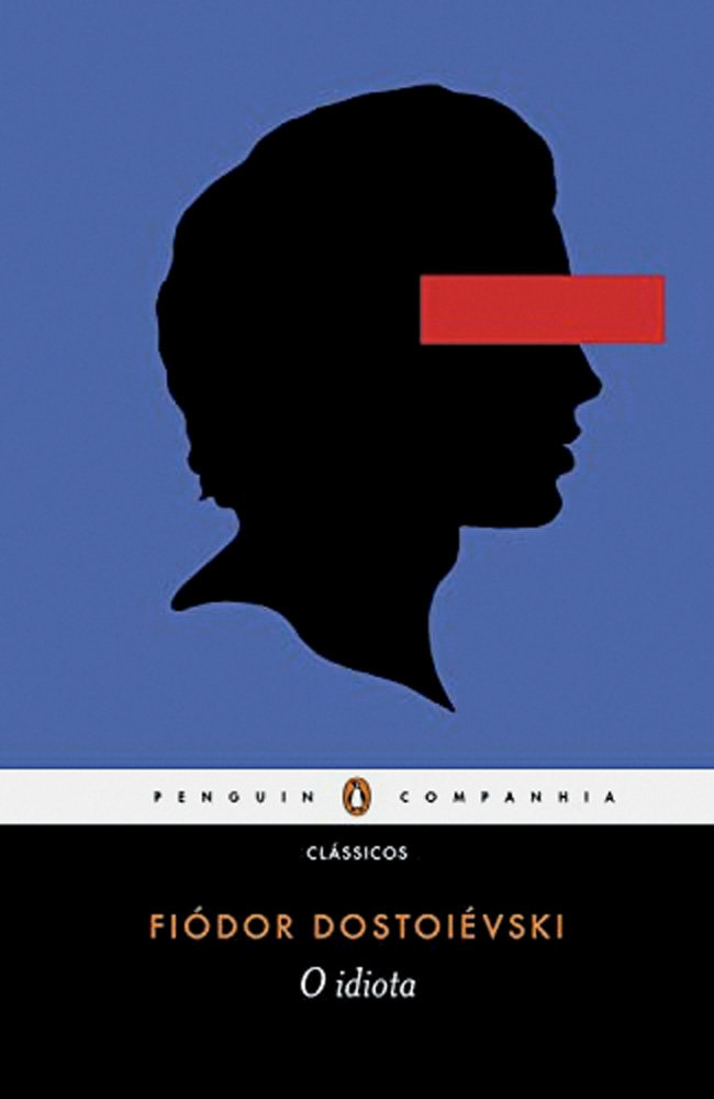 Livro O Idiota, de Fiódor Dostoiévski. Capa azul tem silhueta de homem preta, com faixa vermelha nos olhos