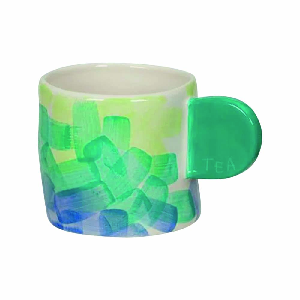 Imagem mostra caneca de cerâmica verde e azul