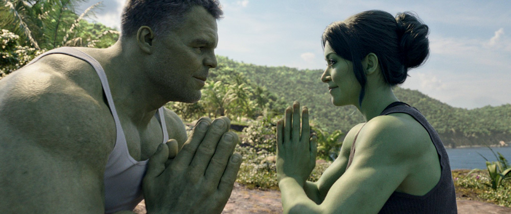 Imagem mostra homem e mulher de pele verde, com as mãos juntas, de frente um para o outro