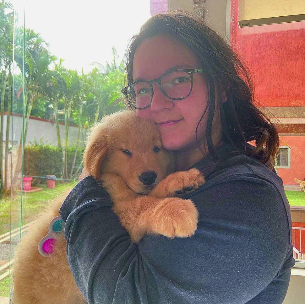 Ania e Boris, seu cão de assistência.