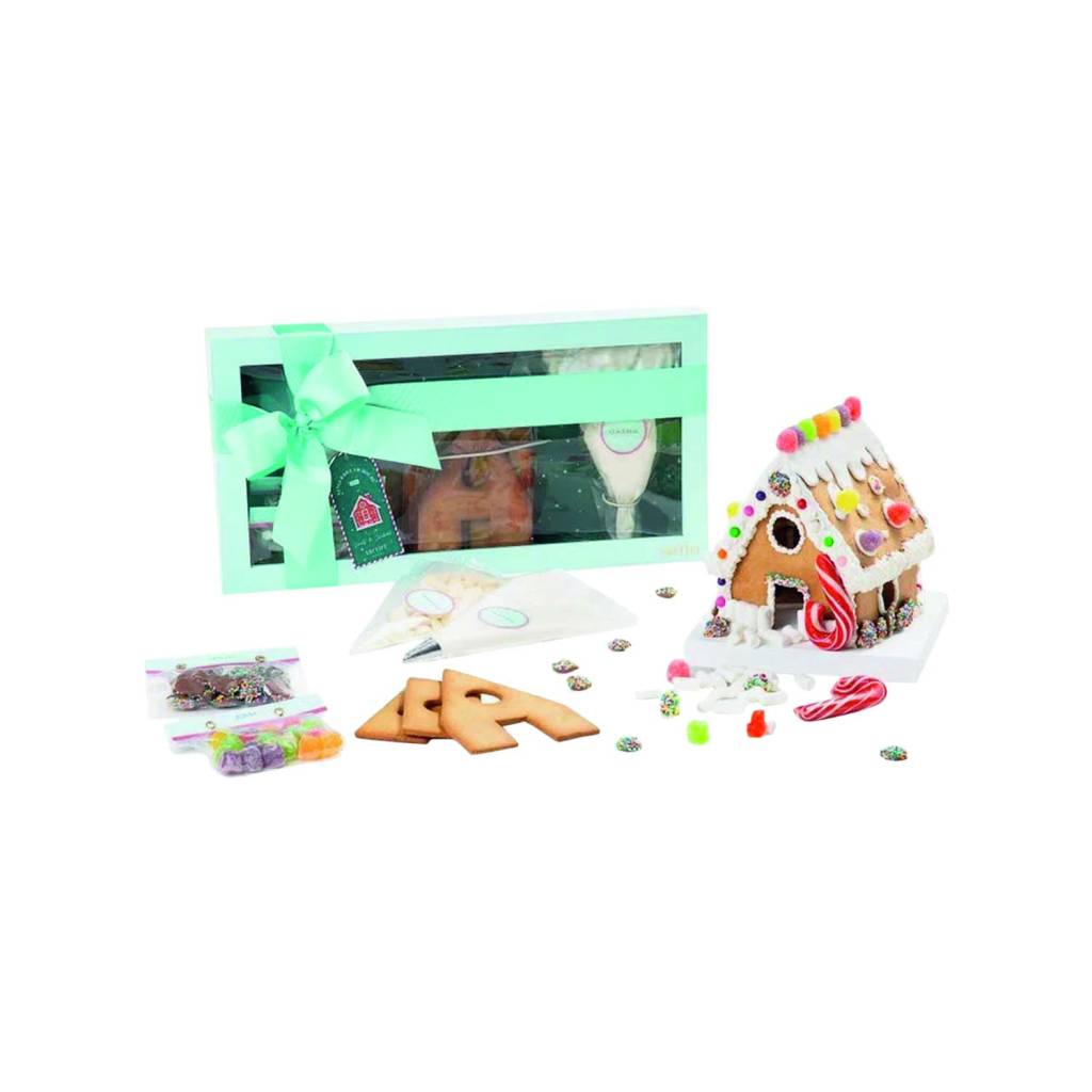 Caixa com confeitos re chocolates para montar uma casa de gingerbread