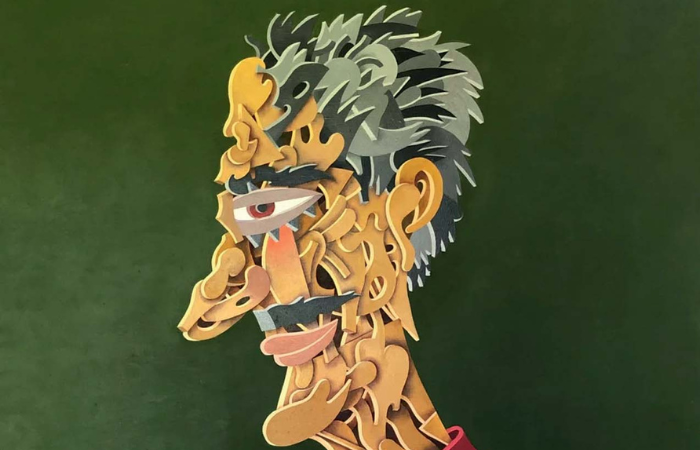 Imagem mostra pintura abstrata de rosto de homem feito com cacos