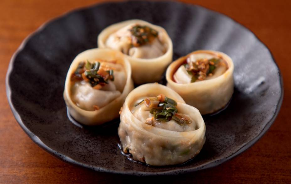 Porção de mandu: pastel com recheio de carnes bovina e suína e kimchi Porção de mandu: pastel com recheio de carnes bovina e suína e kimchi