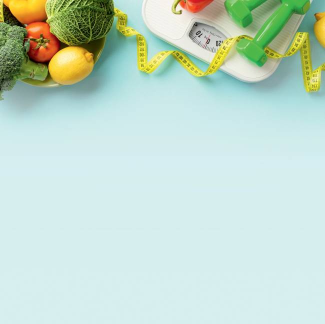 Slimming concept. Top view photo of plate with vegetables cabbage lemons cauliflower tomato dumbbells scales and tape measure on isolated pastel blue background with copyspace A tal felicidade